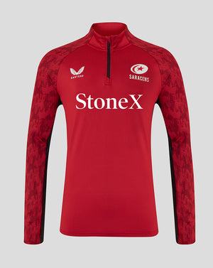 Front view of red Saracens training top with StoneX sponsor, Castore logo, and patterned sleeves with a quarter-zip neck.