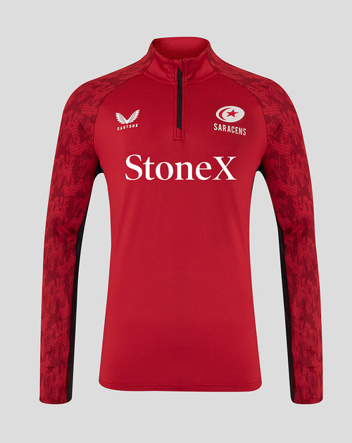 Front view of red Saracens training top with StoneX sponsor, Castore logo, and patterned sleeves with a quarter-zip neck.