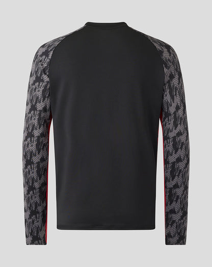 Back view of a black Saracens training drill top with dark grey patterned sleeves