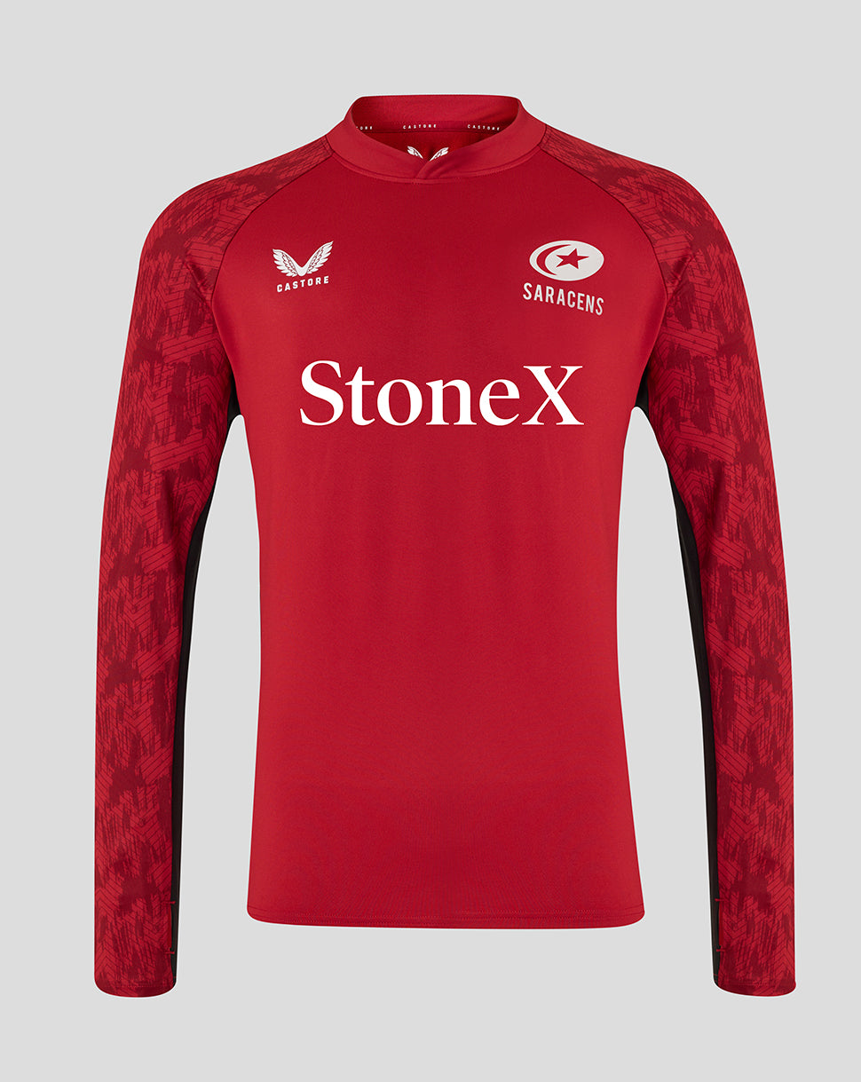 Front view of red Saracens training drill top with patterned sleeves and Castore logo on left chest and Saracens crest on right.