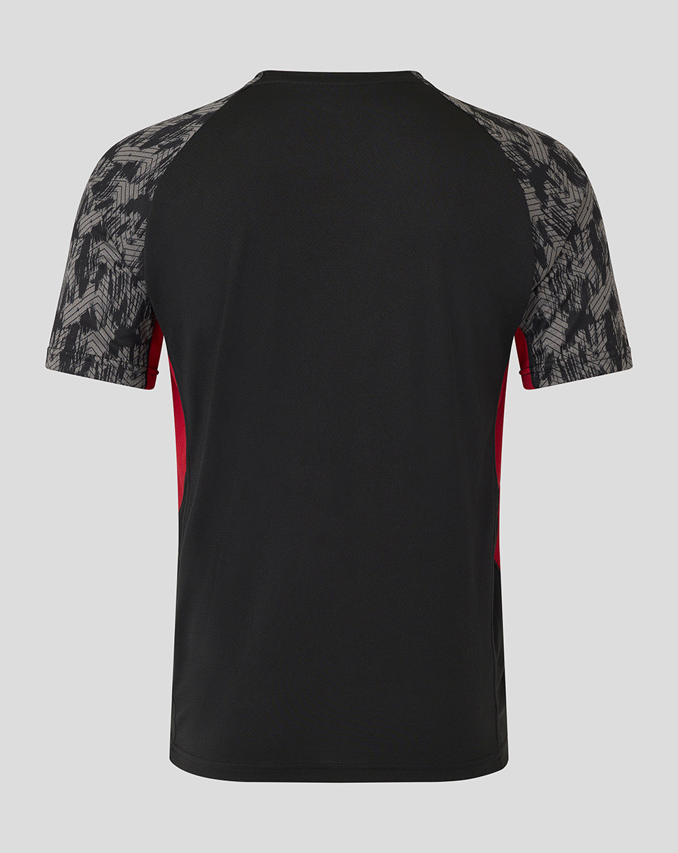 Back view of Saracens training short sleeve tee in black with grey patterned raglan sleeves and red side panels.