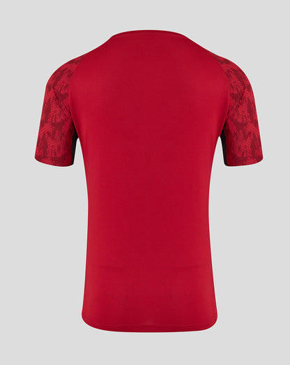 Back view of red Saracens training short sleeve tee with patterned sleeves.