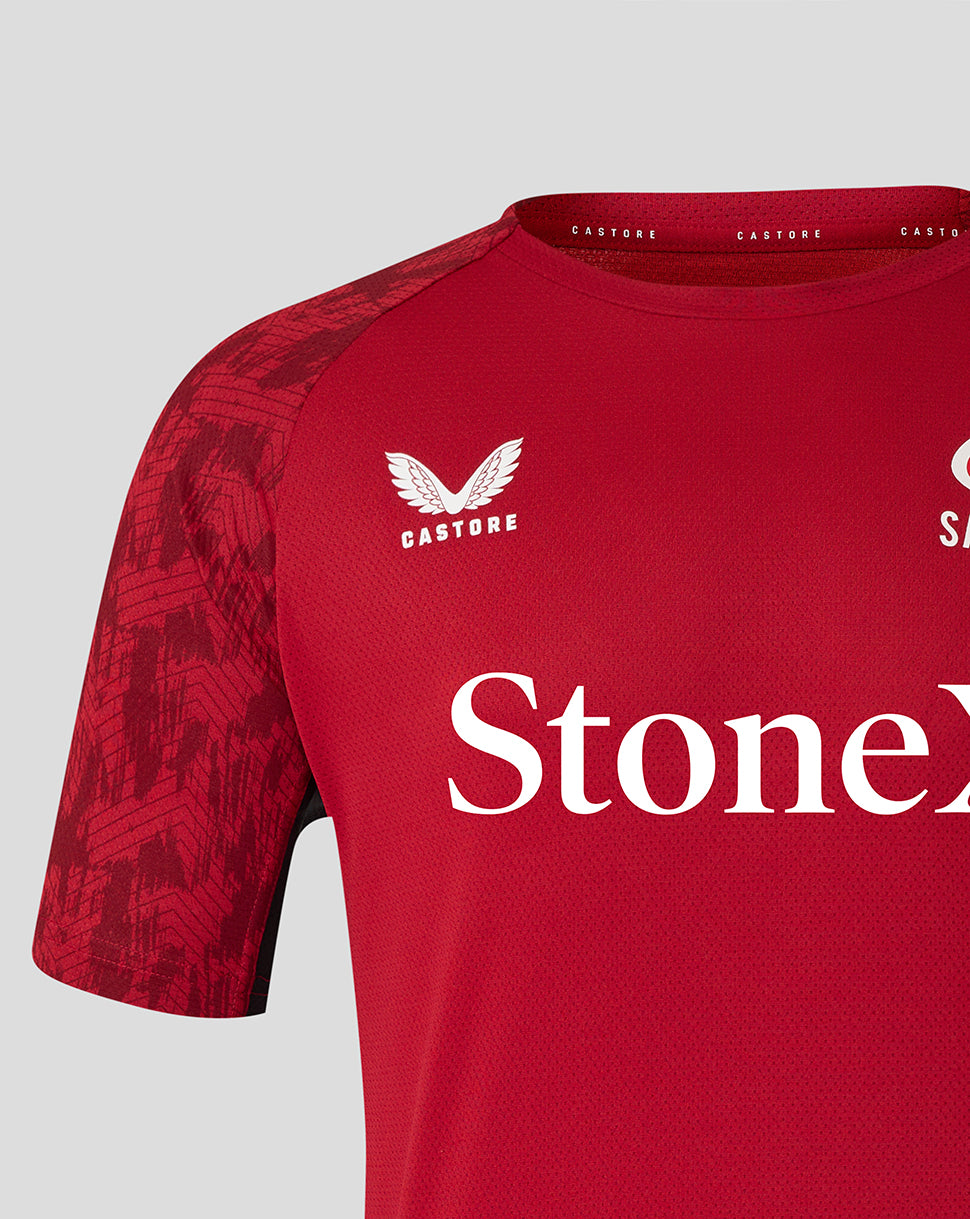 Front close up of red Saracens training tee with white StoneX branding and patterned sleeve.