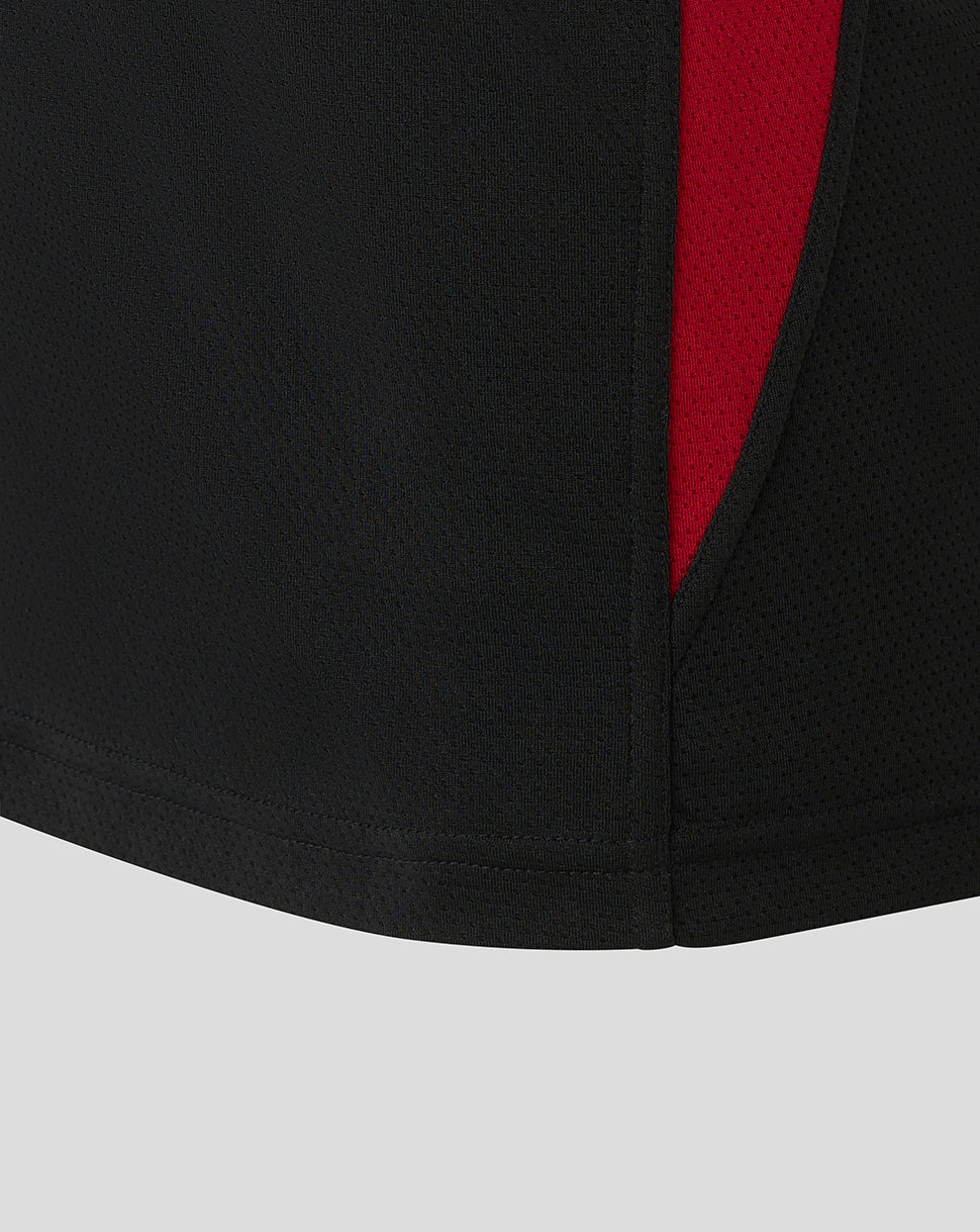 Side view of black Saracens training vest with red panel and perforated fabric detail