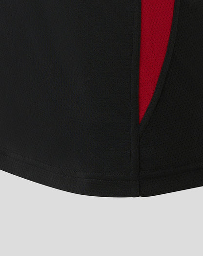 Side view of black Saracens training vest with red panel and perforated fabric detail