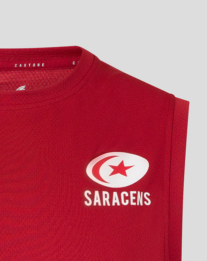 Close-up of red Saracens training vest showing the white Saracens crest on the chest