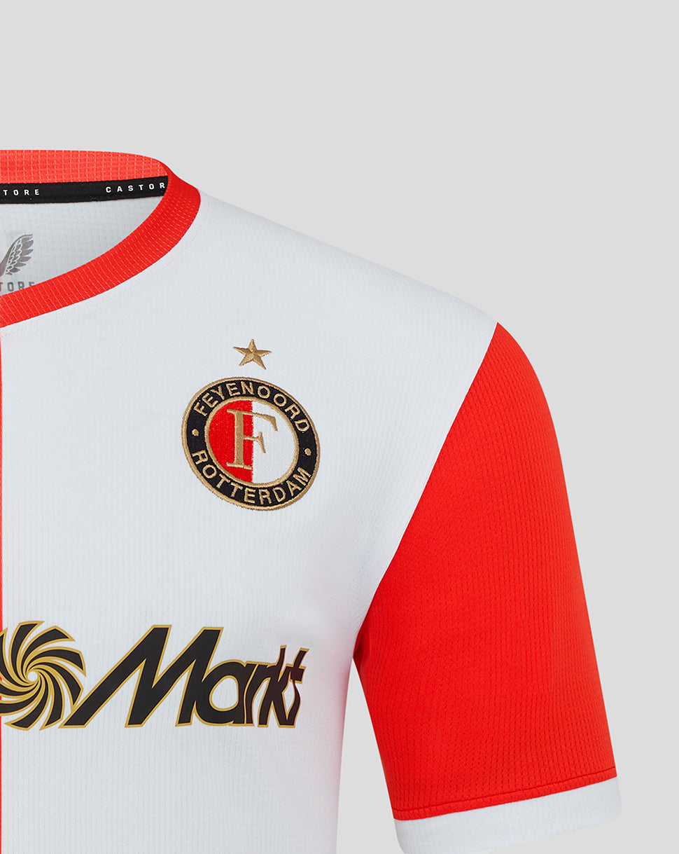 Feyenoord home shirt close up showing crest with gold star on white chest and red sleeve