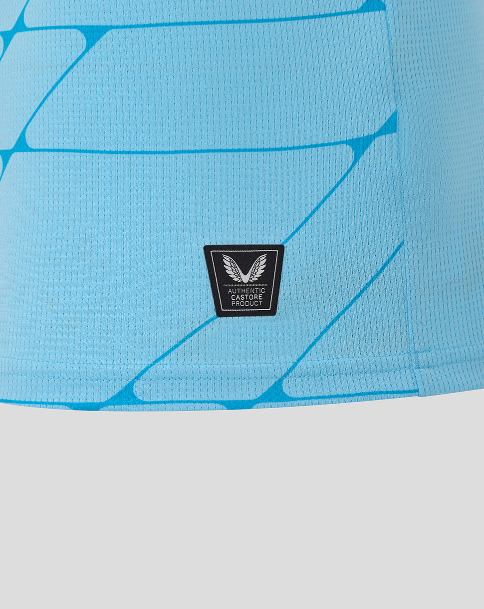Close-up of Feyenoord 25/26 third shirt fabric in blue with authentic Castore product badge