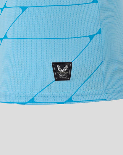 Close-up of Feyenoord 25/26 third shirt fabric in blue with authentic Castore product badge