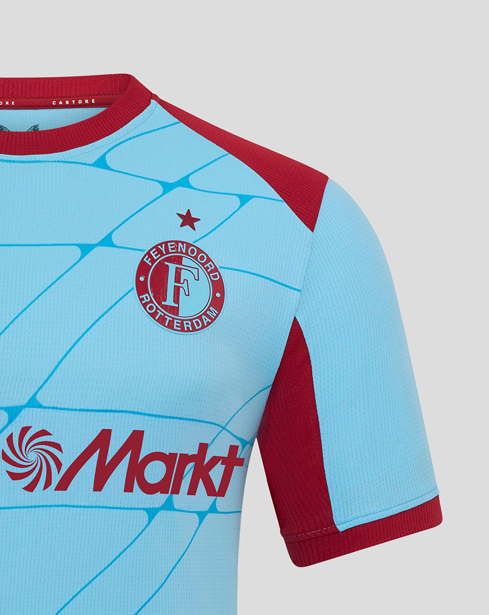 Shoulder and chest close up of Feyenoord third shirt showing crest and sponsor graphic on light blue fabric with maroon sleeves.