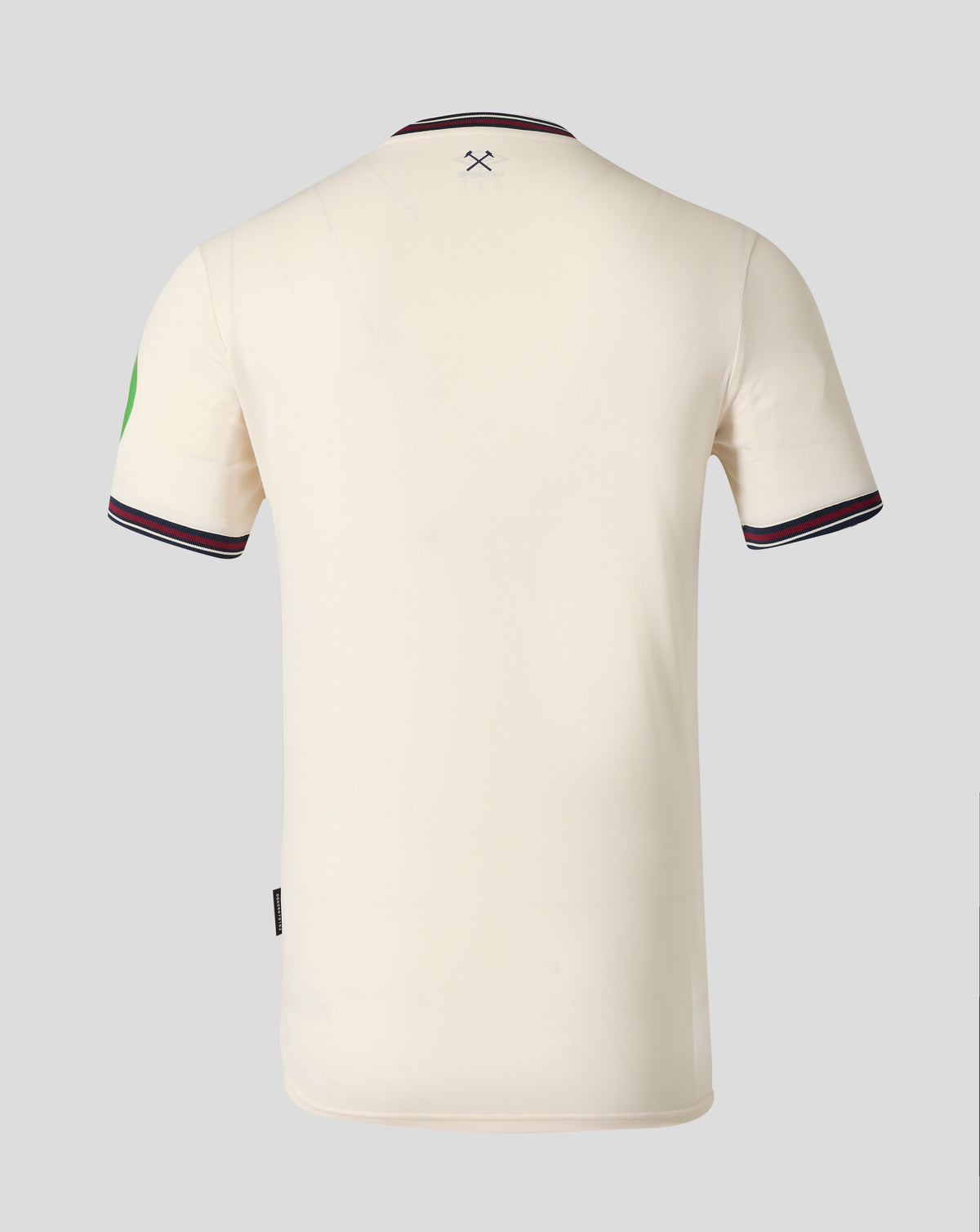Back view of West Ham 25/26 away shirt in cream with a striped collar and a small hammer emblem at the upper back.