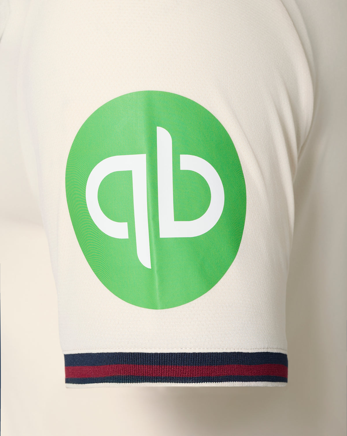 Close up of white West Ham away shirt featuring a large green circular chest graphic