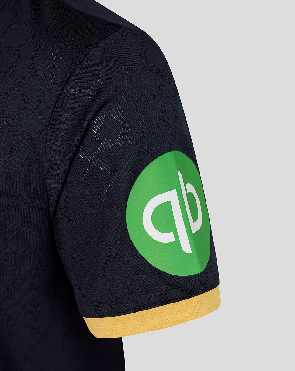 Navy West Ham 25/26 third kit short sleeve shirt showing a bright green circular sponsor patch on the sleeve and yellow cuff.