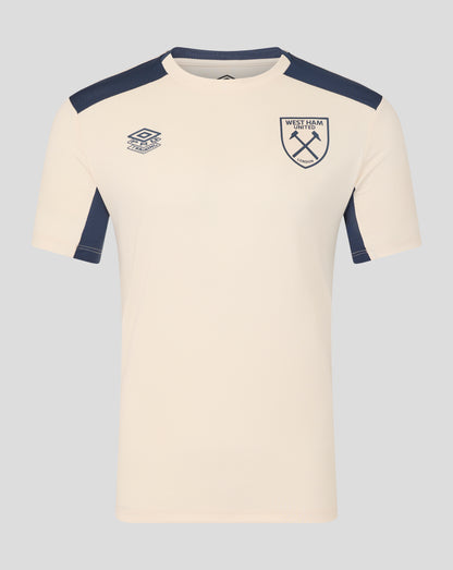 Cream training shirt with navy shoulder panels and West Ham crest on the chest