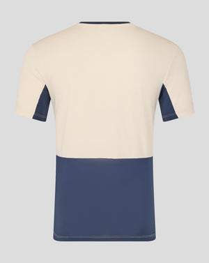 Back view of cream West Ham Pro Training Short Sleeve Shirt with navy panels and contrasting hem
