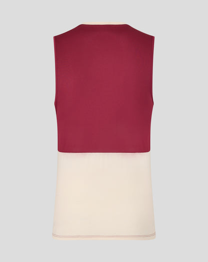 Back view of a burgundy West Ham training sleeveless shirt with a cream hem on a mannequin