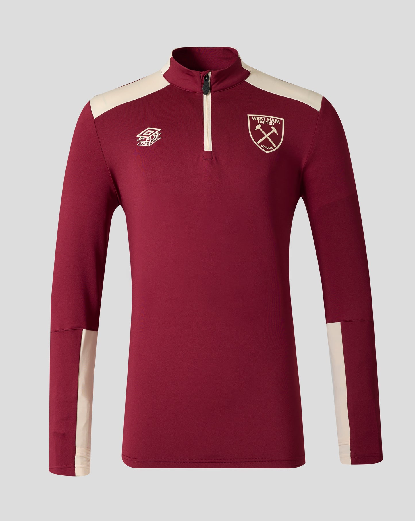 West Ham United Pro Training Midlayer top in Rhododendron with cream shoulder panels and chest crest.