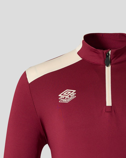 Front view detail of zipper and crest on West Ham United training midlayer top in rhododendron red