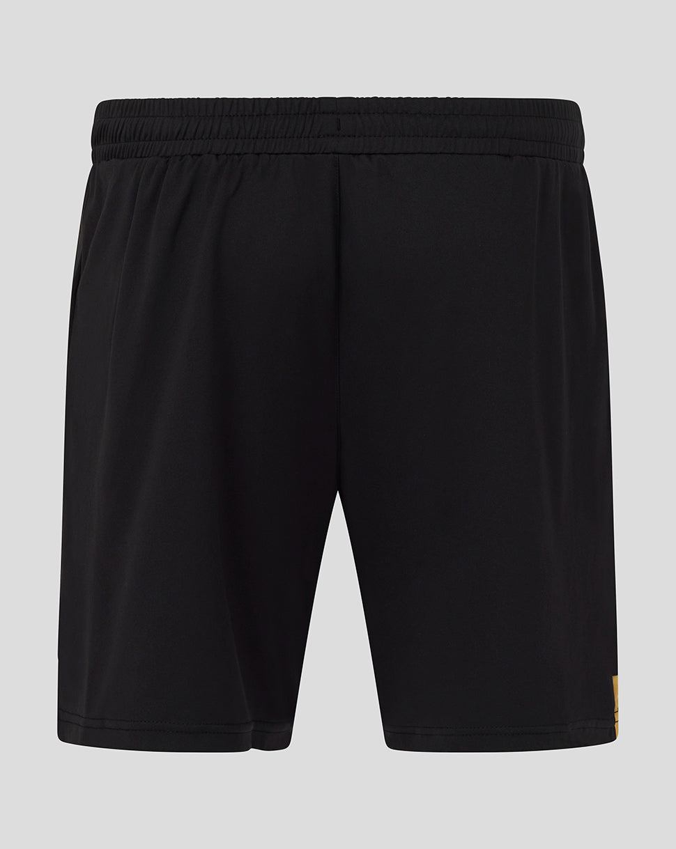 Back view of black AFC Bournemouth shorts showing crest at lower left and a yellow side stripe