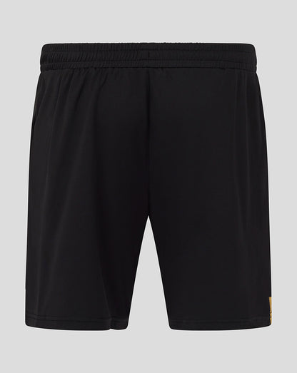 Back view of black AFC Bournemouth shorts showing crest at lower left and a yellow side stripe