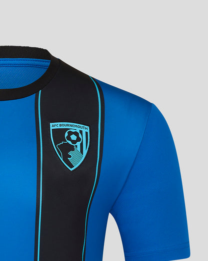 Close up of chest on blue AFC Bournemouth home shirt featuring a black vertical stripe with turquoise trim and the club crest