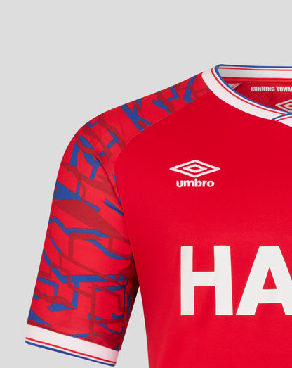 Ipswich Town away shirt sleeve in red with blue geometric pattern and white collar trim