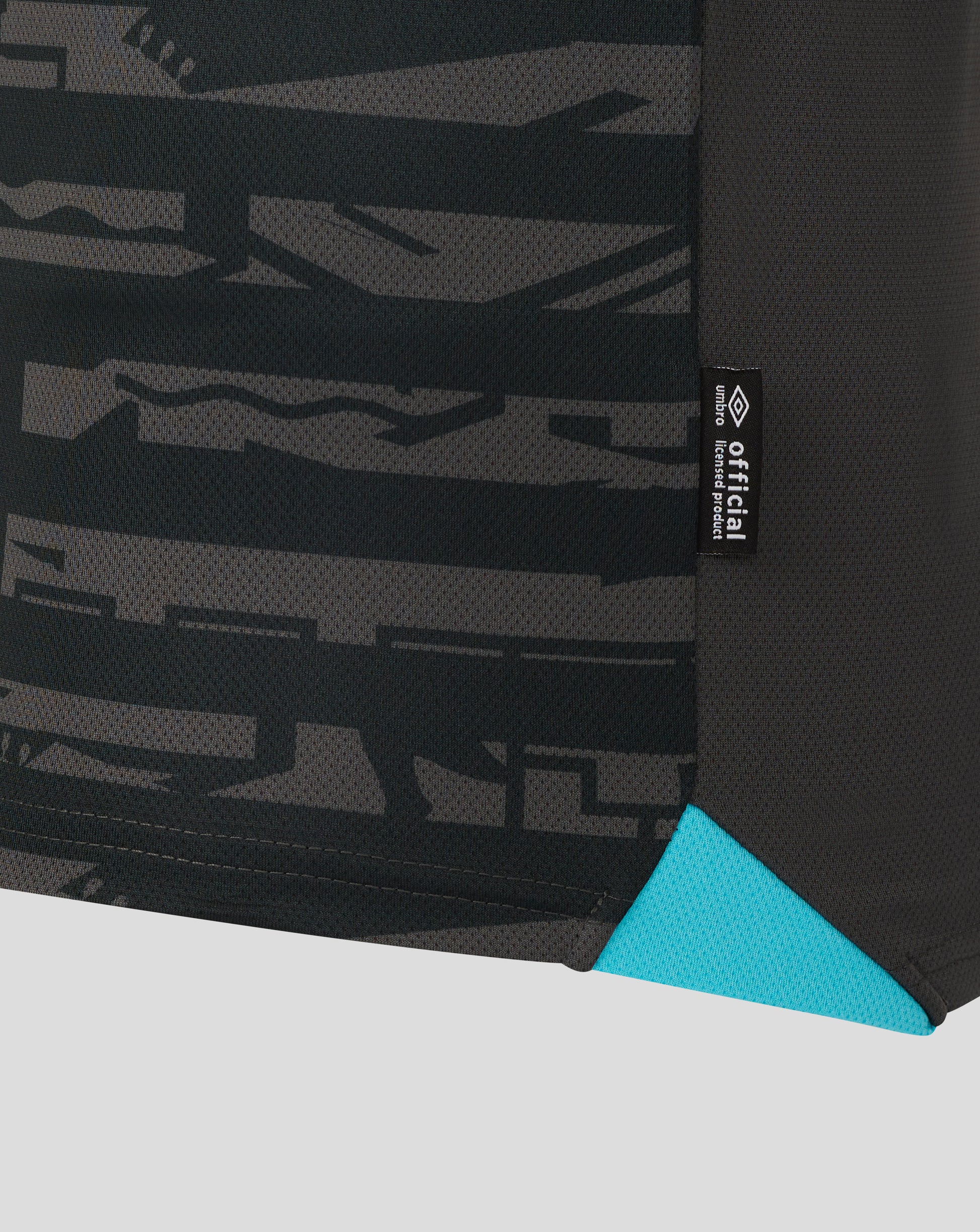 Side panel with dark camouflage pattern and a black official licensed product tag