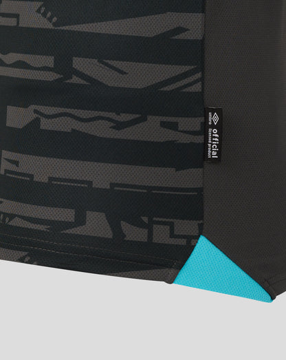 Side panel with dark camouflage pattern and a black official licensed product tag