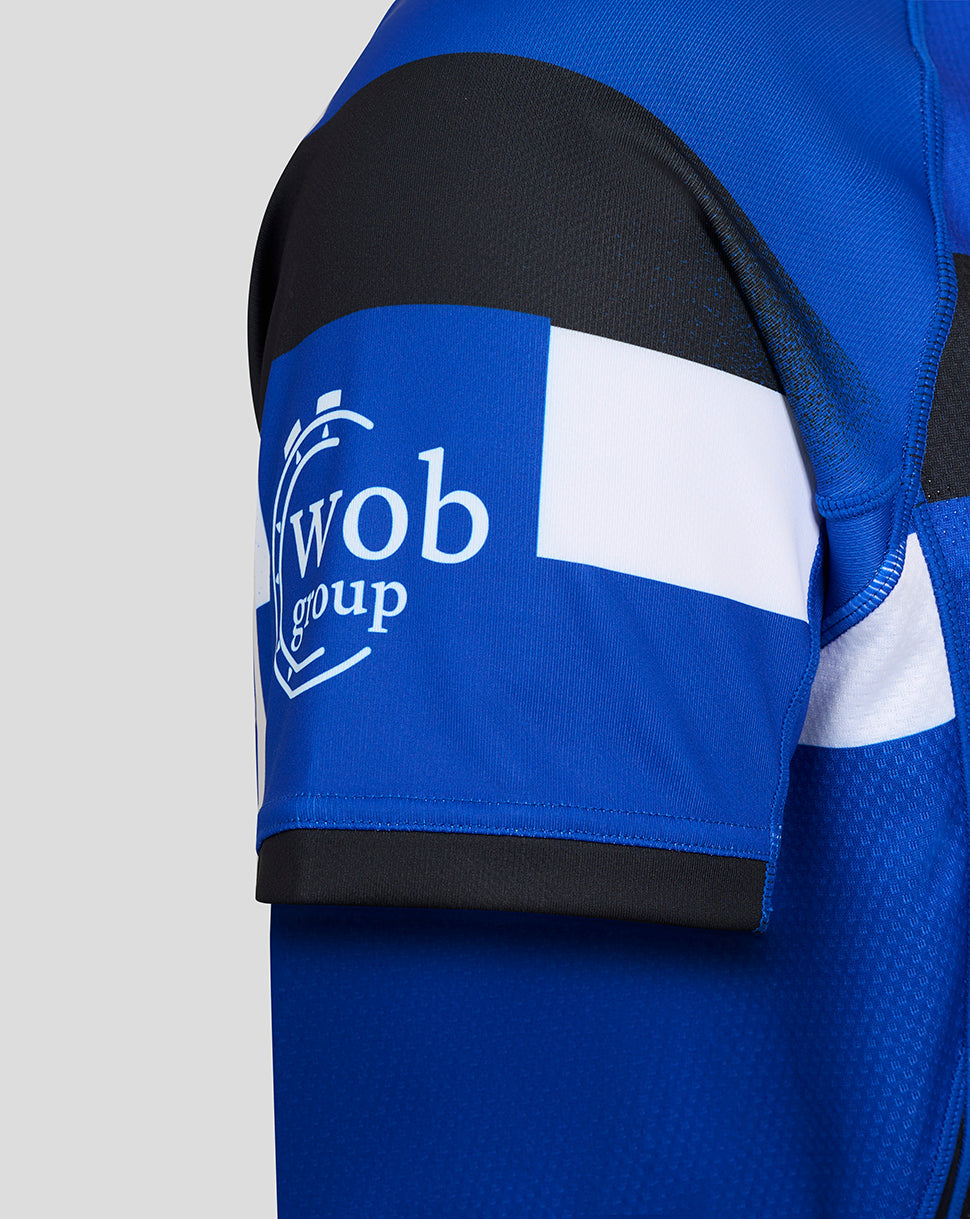 Side view of Bath Rugby Pro Shirt sleeve with Wob Group logo on blue panel.