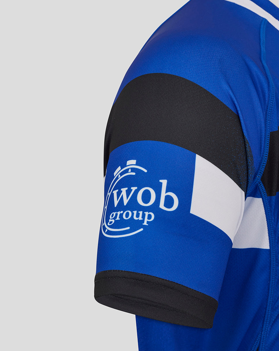 Bath Rugby Home Replica Shirt sleeve with blue armband and Wob Group logo.