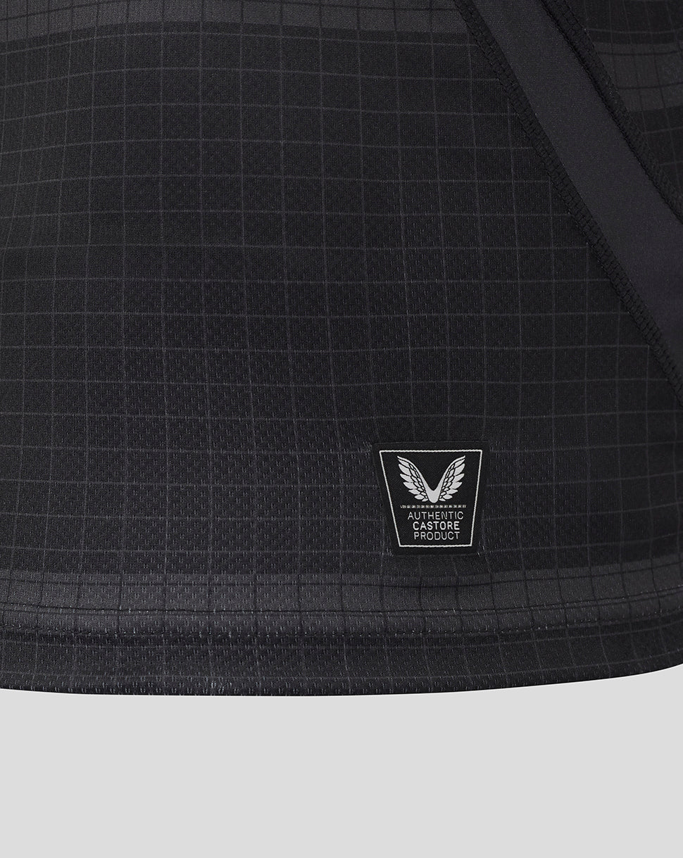 Lower front of Bath Rugby replica shirt showing authentic Castore product patch on grid fabric