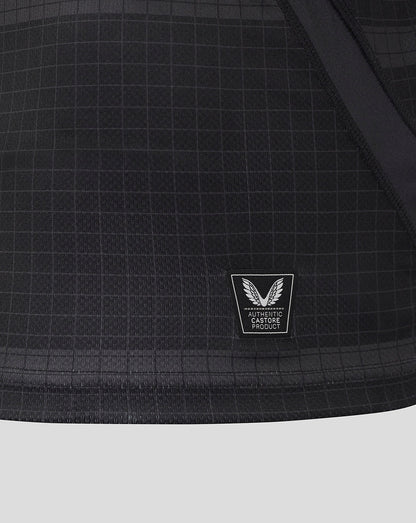Lower front of Bath Rugby replica shirt showing authentic Castore product patch on grid fabric