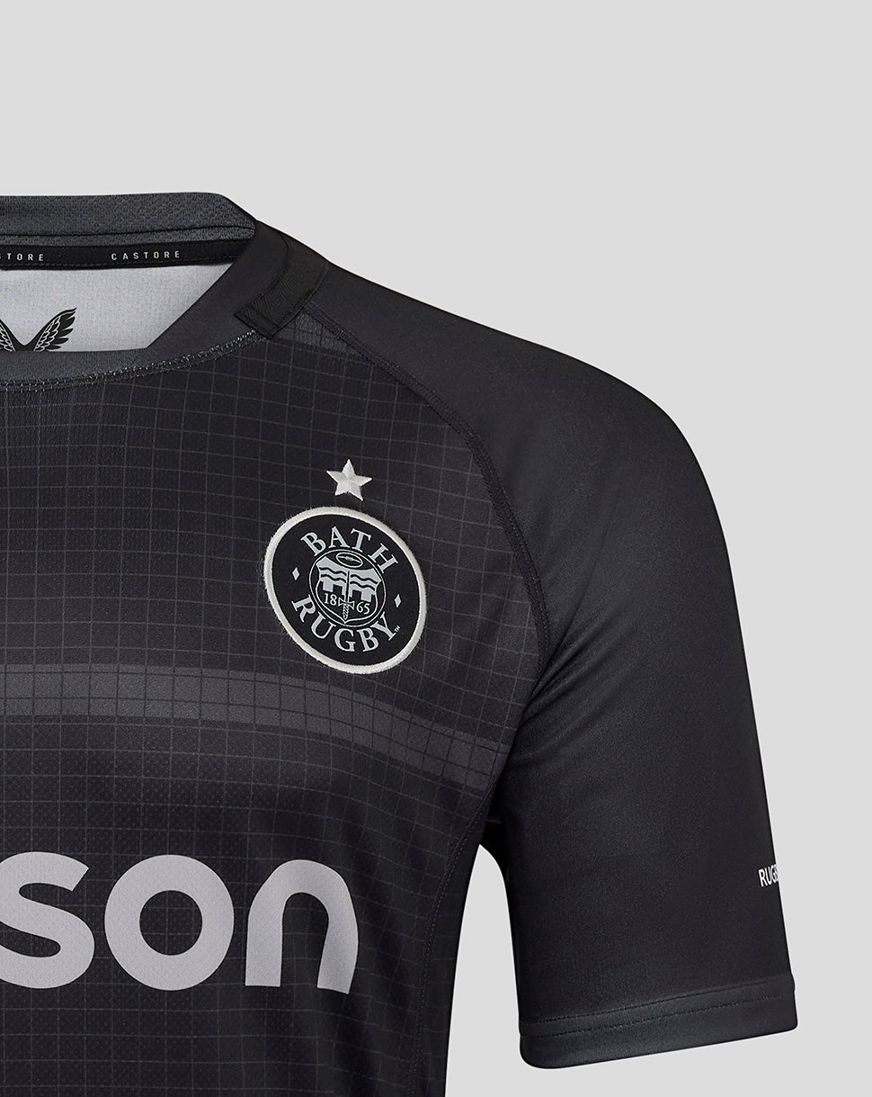 Close up of Bath Rugby shirt showing crest on left chest with a star above and a subtle grid pattern
