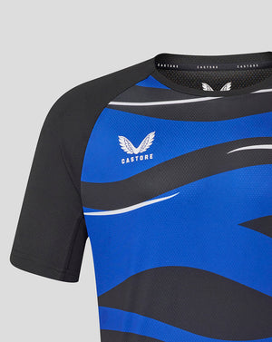 Close up of Bath Rugby graphic tee with bold blue and black panels and a white wing logo.
