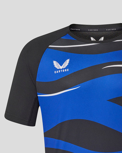 Close up of Bath Rugby graphic tee with bold blue and black panels and a white wing logo.