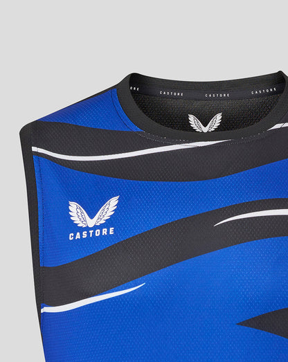 Close up of blue and black graphic sleeveless tee with Castore branding at the neckline and wing emblem on the chest
