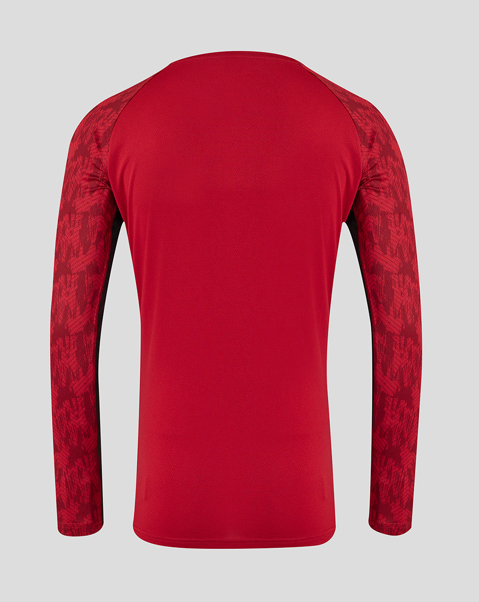 Back view of red Saracens training long sleeve tee with patterned sleeves.