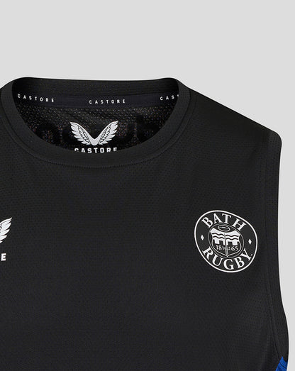 Close up of black Bath Rugby sleeveless tee with Castore label at the neck and a partial Bath Rugby crest on the chest.
