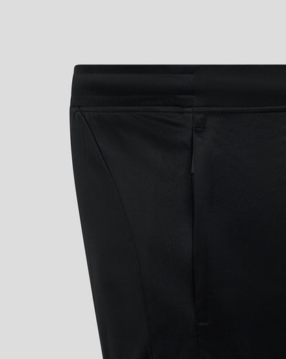Waistband close-up on black Bath Rugby training knit shorts showing a side panel seam.