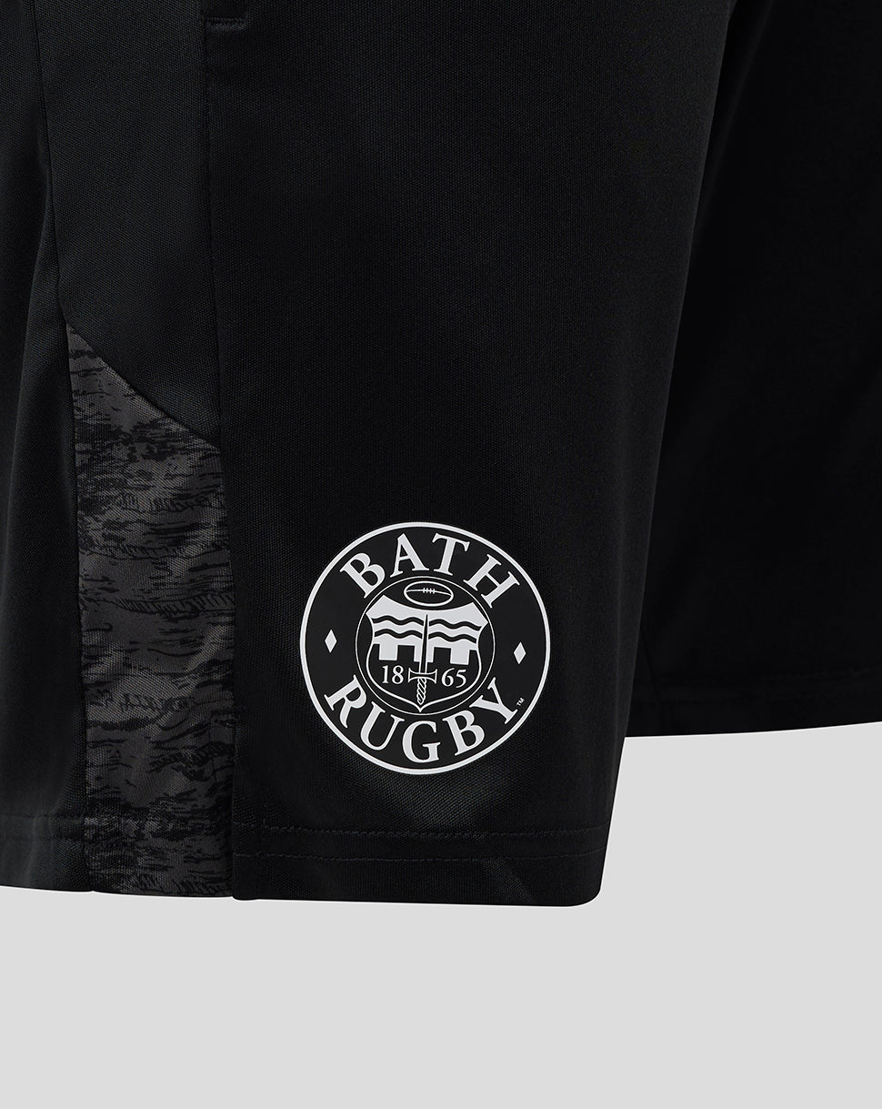 Close-up of black Bath Rugby training knit shorts showing a circular Bath Rugby logo at the hem.