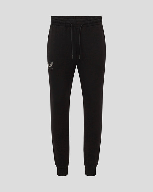 Full-length view of black Bath Men's Travel Knit Pants with drawstring waistband and side pockets