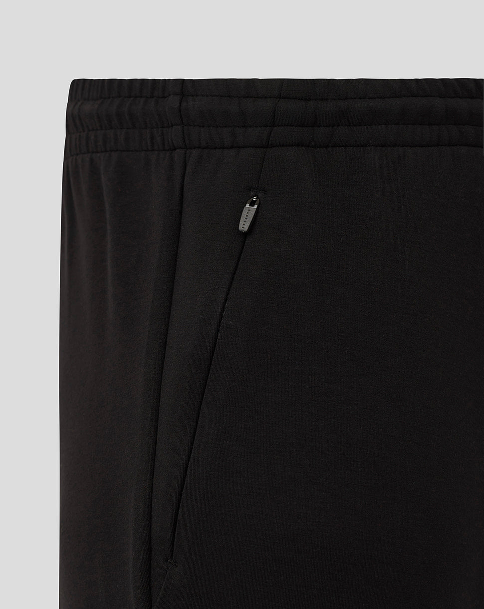 Close up of black Bath Travel Knit Pants showing elastic waistband and zippered side pocket