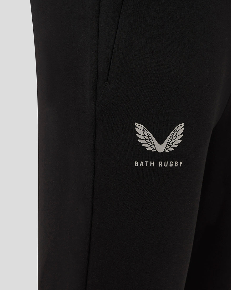 Close-up of the Bath Rugby wing logo and Bath Rugby text on a black Travel Knit Pant leg