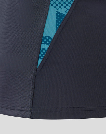 Close-up of navy England Rugby jersey side seam with turquoise patterned panel peeking through