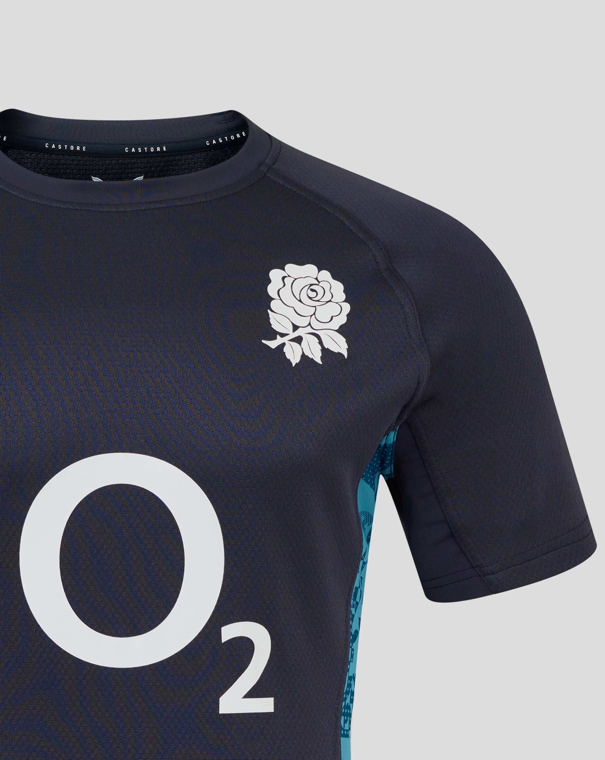 Close up of the navy England Rugby jersey chest area showing a white rose crest near the shoulder