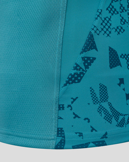 Close-up of teal fabric and seam on England Rugby Men's Contact Short Sleeve Jersey featuring a geometric print.