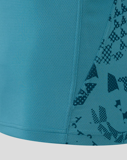 Close up of storm blue England Rugby performance fabric with a dotted mesh texture and diagonal patterned panel