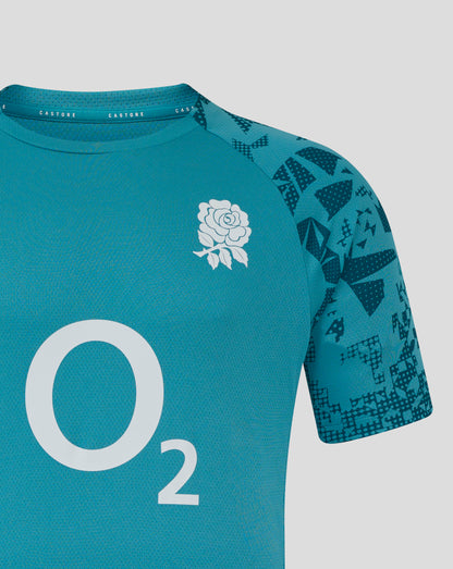 Close-up of Storm Blue England Rugby training shirt showing white rose crest on left chest and geometric patterned sleeves