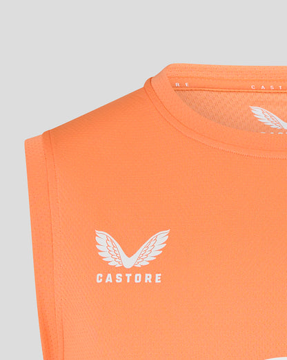 Close up of Castore logo and wing on melon orange sleeveless rugby T shirt