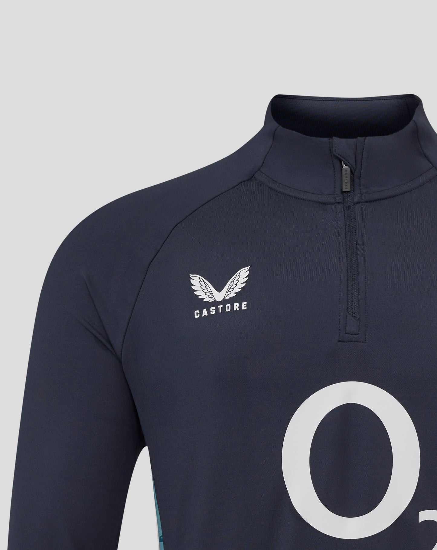 Close-up of navy England rugby midlayer collar with funnel neckline and quarter zip